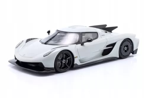Light gray 1:18 diecast model car with front splitter and rear wing