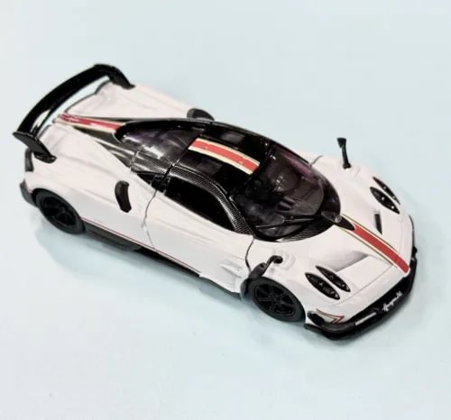 White diecast model sports car with black hood and red stripe, 2017-style.