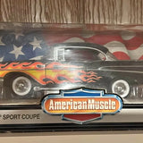Diecast black car model with red flames and American Muscle front emblem