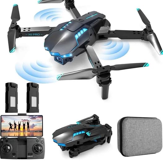 Foldable black quadcopter drone with blue LED lights, remote controller, and gray carrying case