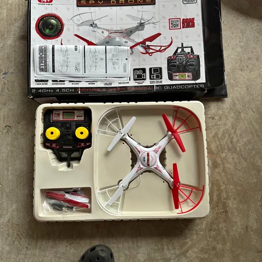 Kids quadcopter drone with camera set, red-and-white props and controller in box
