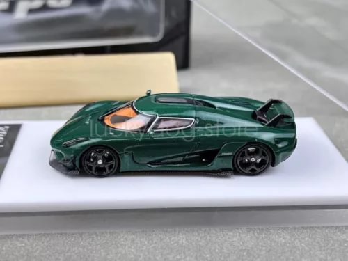 Green diecast sports racing car model, 1:64 scale, open-wheel front view