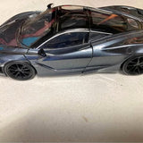 McLaren 720s diecast model car, dark blue side view with black roof and wheels