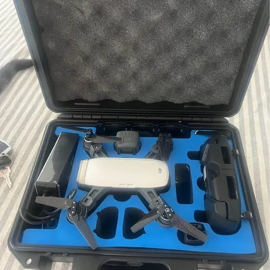 DJI drone with controller accessories in open hard case, blue interior