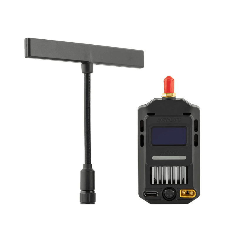 RF module with OLED screen, orange antenna cap, and connector pins