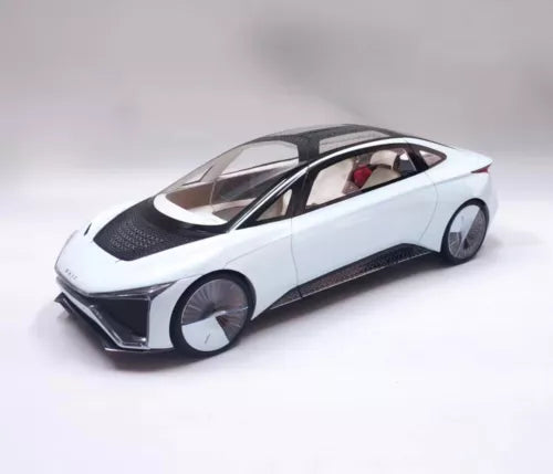 White die-cast concept car model with black wheels, front three-quarter view