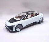 White die-cast concept car model with black wheels, front three-quarter view