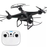 Black quadcopter drone with camera and white TXD-8 remote controller, four propellers