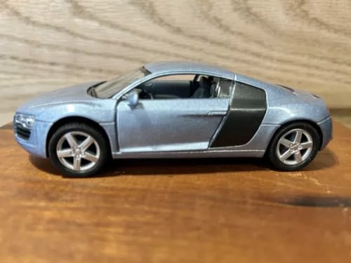 Light blue sports car diecast model, black side stripe, 1:36 scale pullback