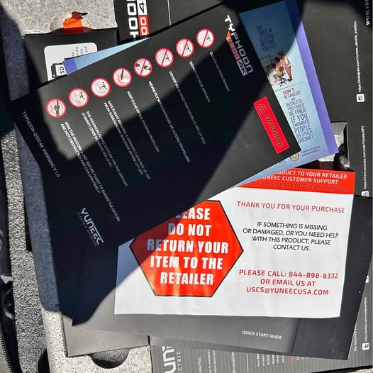 Drone shipping box with return instructions and customer support contact label