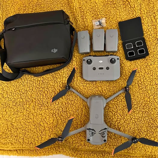 Drone with carrying bag and extra batteries, filters, and propeller sticks