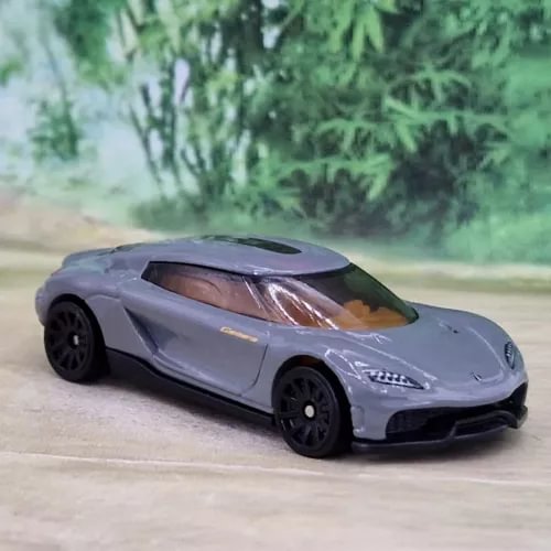 Hot Wheels Koenigsegg Gemera diecast model car, light gray with black wheels
