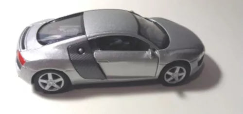 Gray diecast sports car toy with black accents, side profile, pull-back action.
