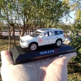 1/43 white SUV diecast model on display stand, side view