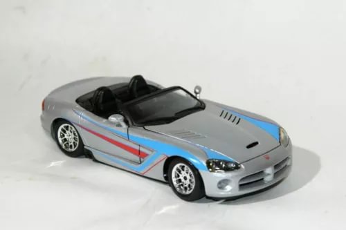 Silver diecast convertible sports car model with blue and red side stripes