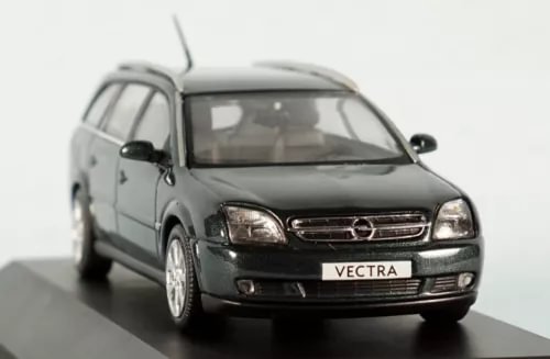 Dark green Opel Vectra diecast model car, front view with grille and headlights