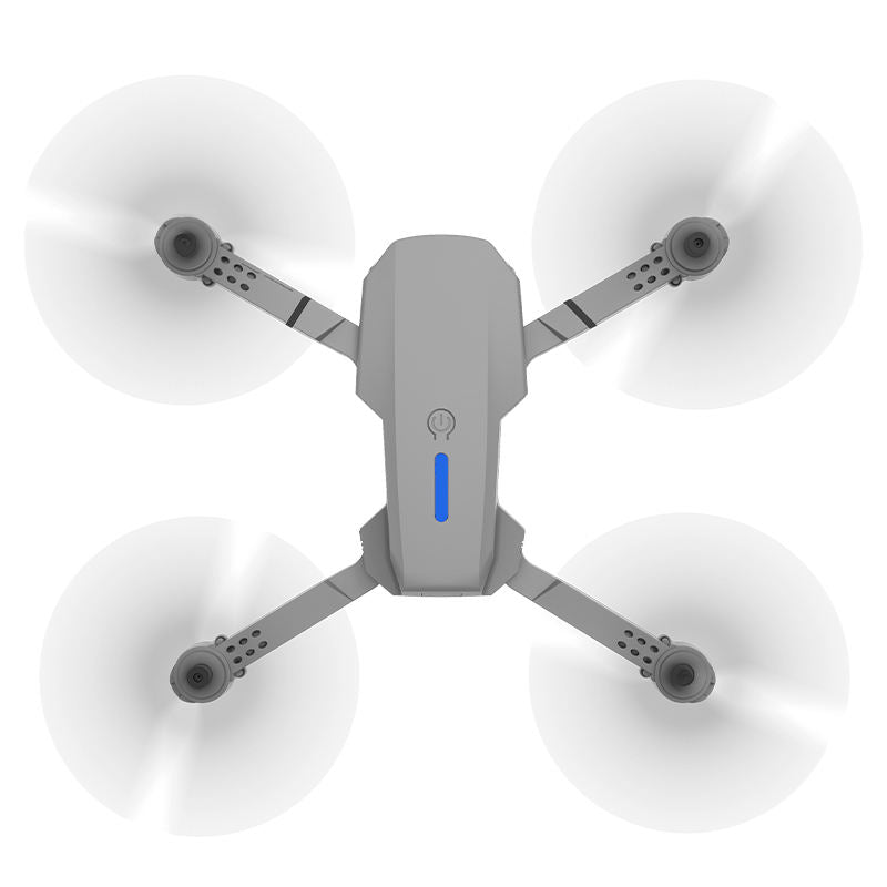 Quadcopter drone with four propellers and gray body