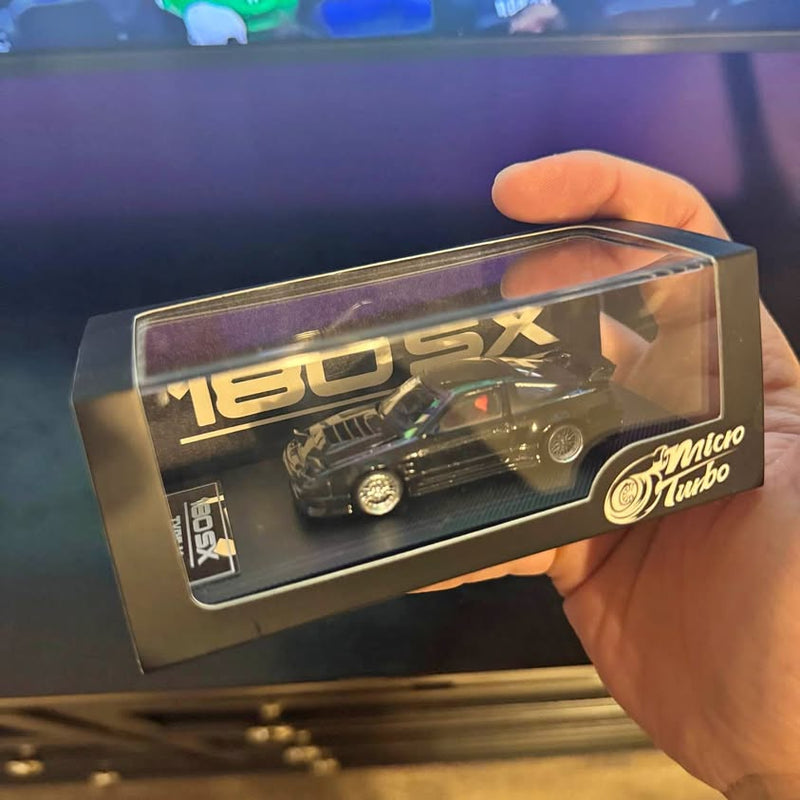 Diecast car model in clear display box with Mesa AZ branding, black car