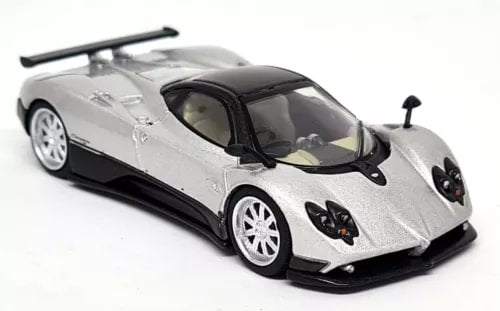 Silver diecast supercar model with black hood vents and headlights, front view