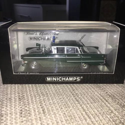 Minichamps diecast police car model in clear display box, dark green with markings