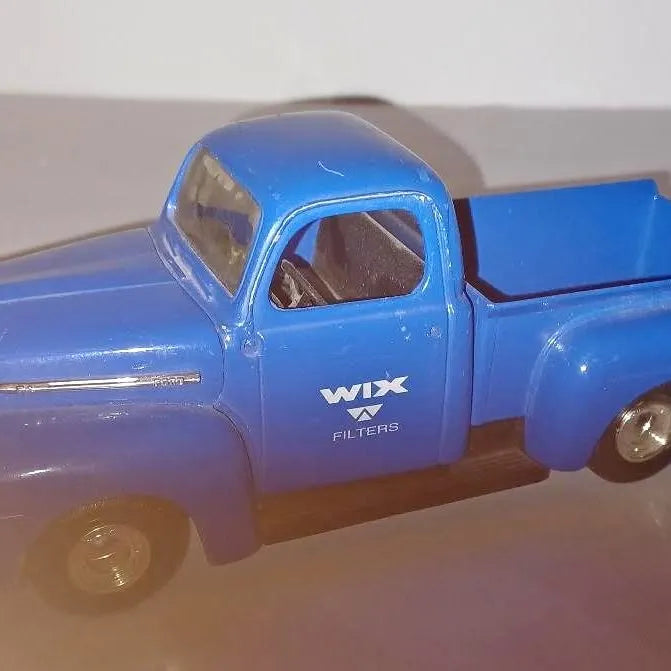 Blue diecast pickup truck with WIX Filters logo, open cab, and detailed grille