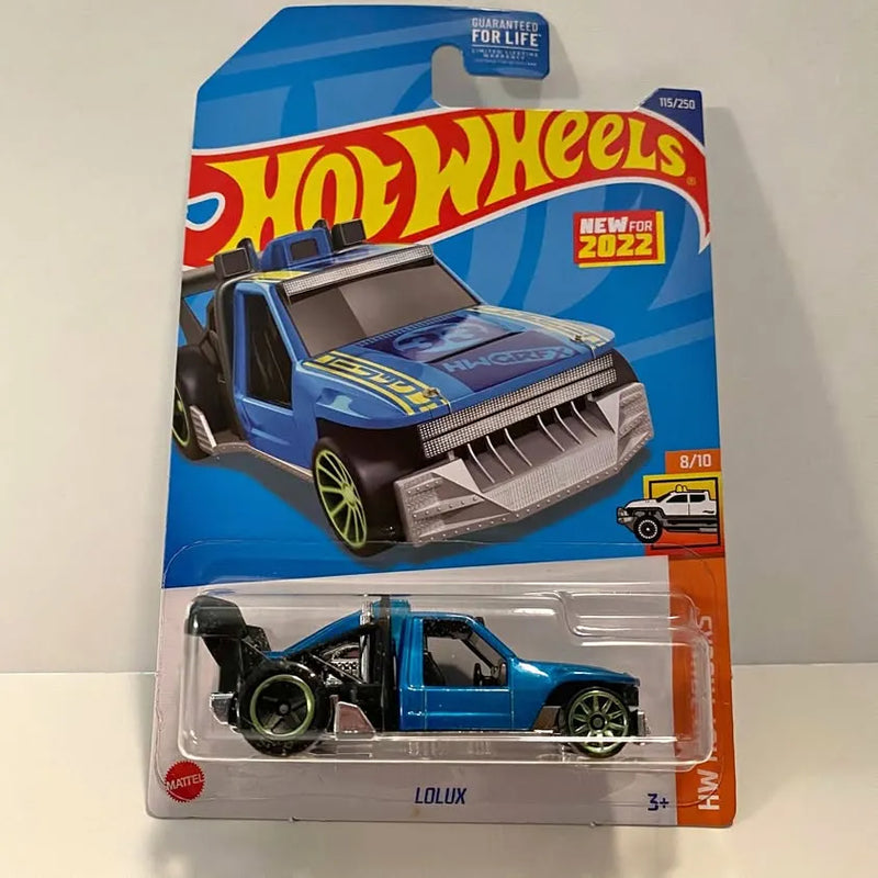 Hot Wheels Lolux blue diecast truck with open grille, green rims in blister pack