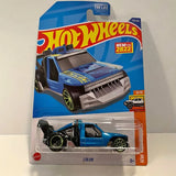Hot Wheels Lolux blue diecast truck with open grille, green rims in blister pack