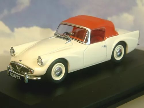 Die-cast model car with raised hood, ivory body and orange-red hood