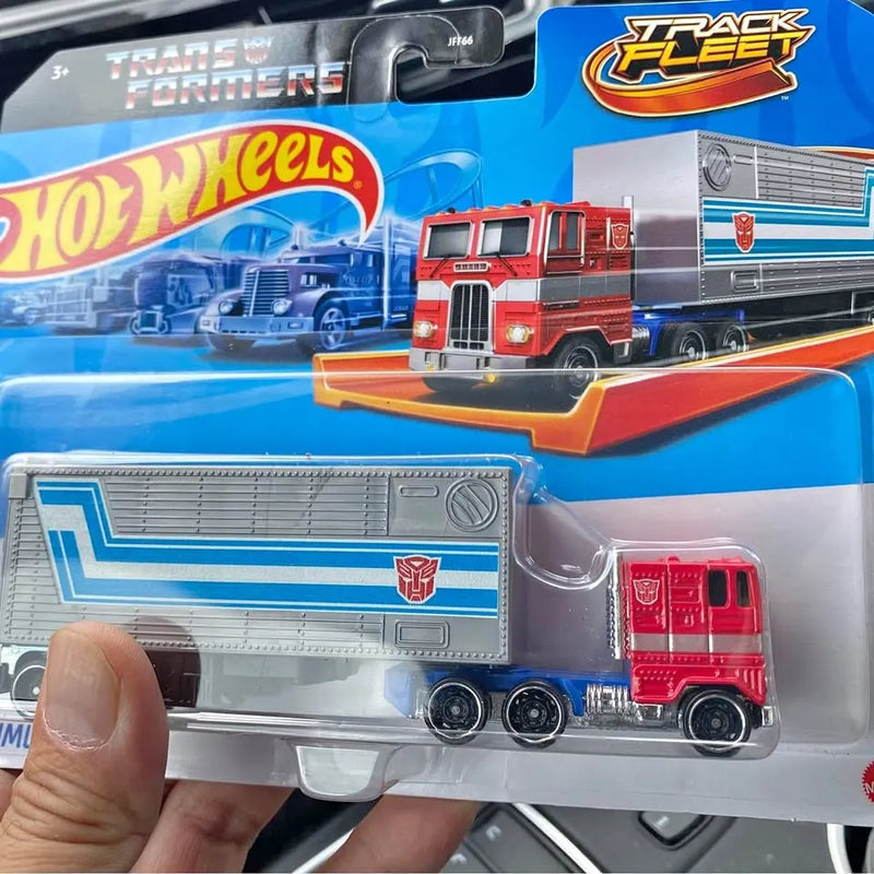 Hot Wheels Track Fleet Transformers Optimus Prime diecast truck, red cab and gray trailer