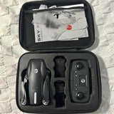 Drone with camera in black hard case, controller and extra parts visible