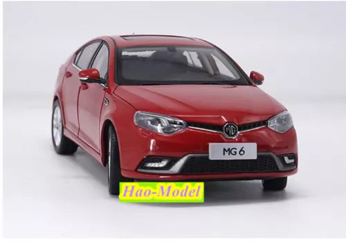 Red MG6 diecast model car in front 3/4 view, with front grille and headlights
