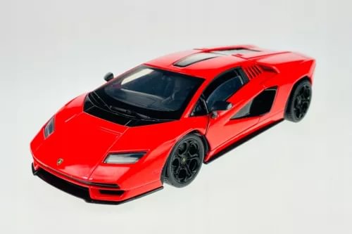 Red diecast sports car model with black stripes, front three-quarter view