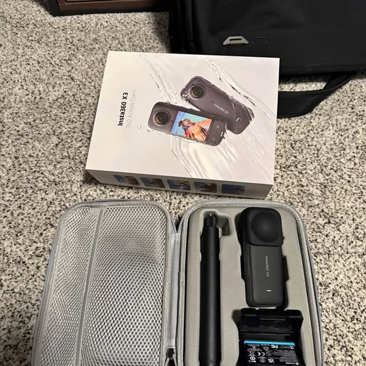 Insta360 X3 action camera kit in open hard case with black camera module