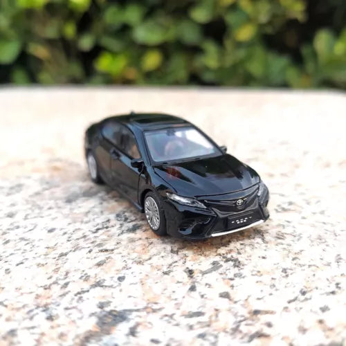 Black diecast model car, 3/4 front view, detailed grille and headlights