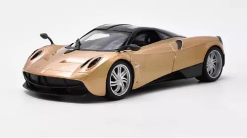 Tan diecast sports racing car model with black accents, silver wheels
