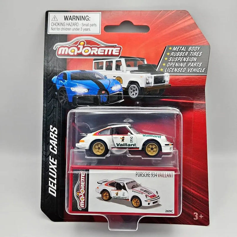 Diecast race car toy in retail blister pack, white with red and gold details