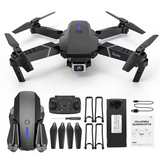 Foldable quadcopter drone with 4-blade propellers and front camera, plus remote and accessories