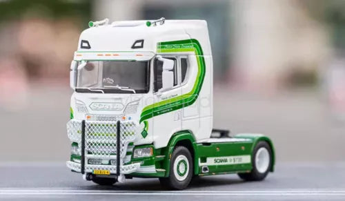 White and green diecast tractor unit truck model with detailed front grille and cab