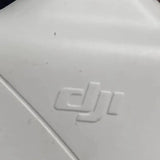 DJI drone body close-up with embossed lettering