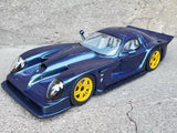 Diecast sports model car in dark blue with yellow wheels, front three-quarter view.