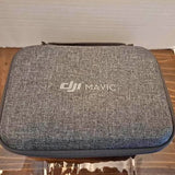 Gray DJI Mavic drone carrying case with Mavic logo, zippered storage