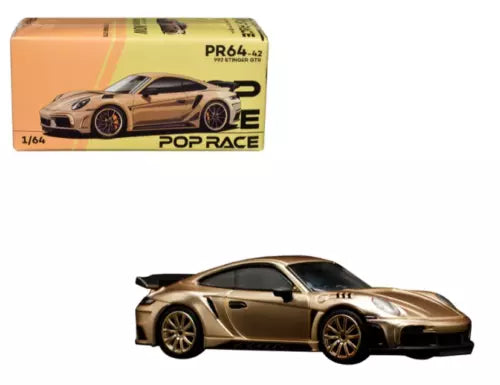 Gold 1:64 diecast sports car model with black aero kit