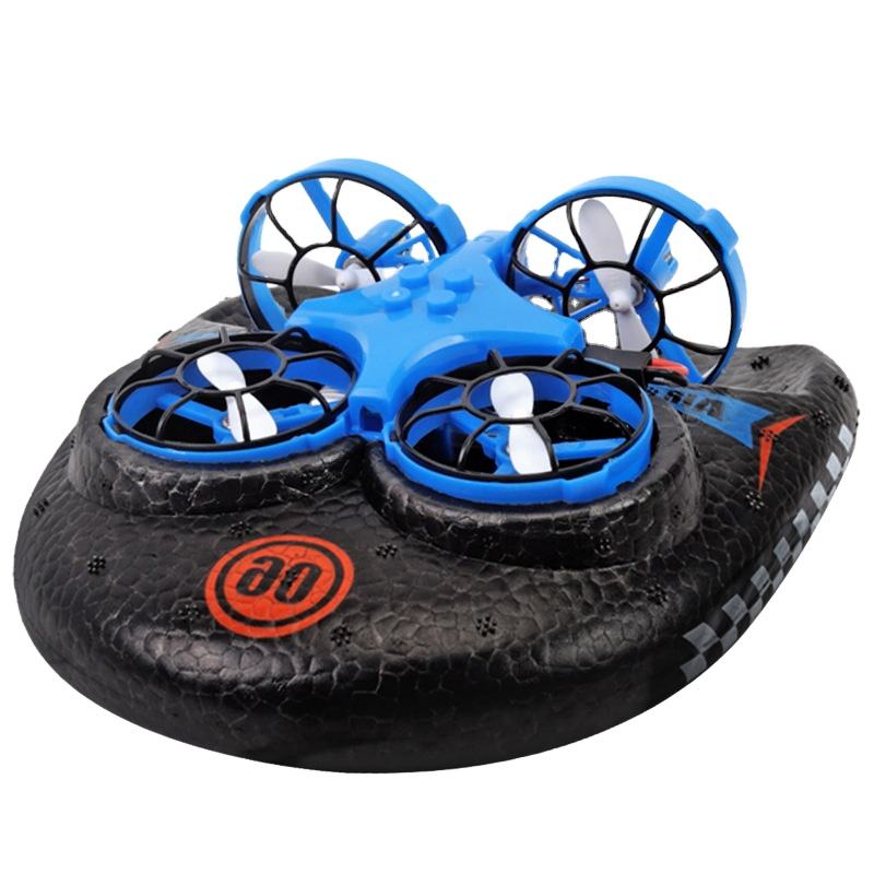 Mini RC quadcopter drone with four blue propeller guards and black tire-style body