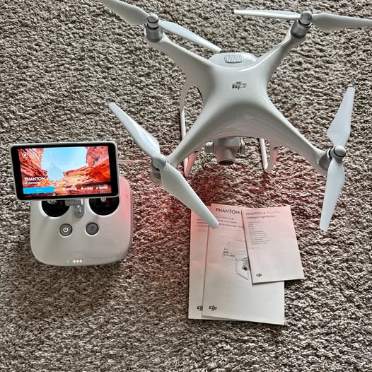 DJI Phantom 4 Pro+ drone with controller, gray with four rotors and front camera