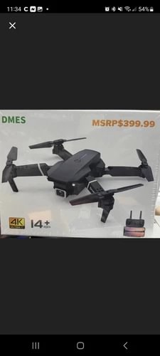 Foldable dark gray 4K drone with four propellers and remote controller