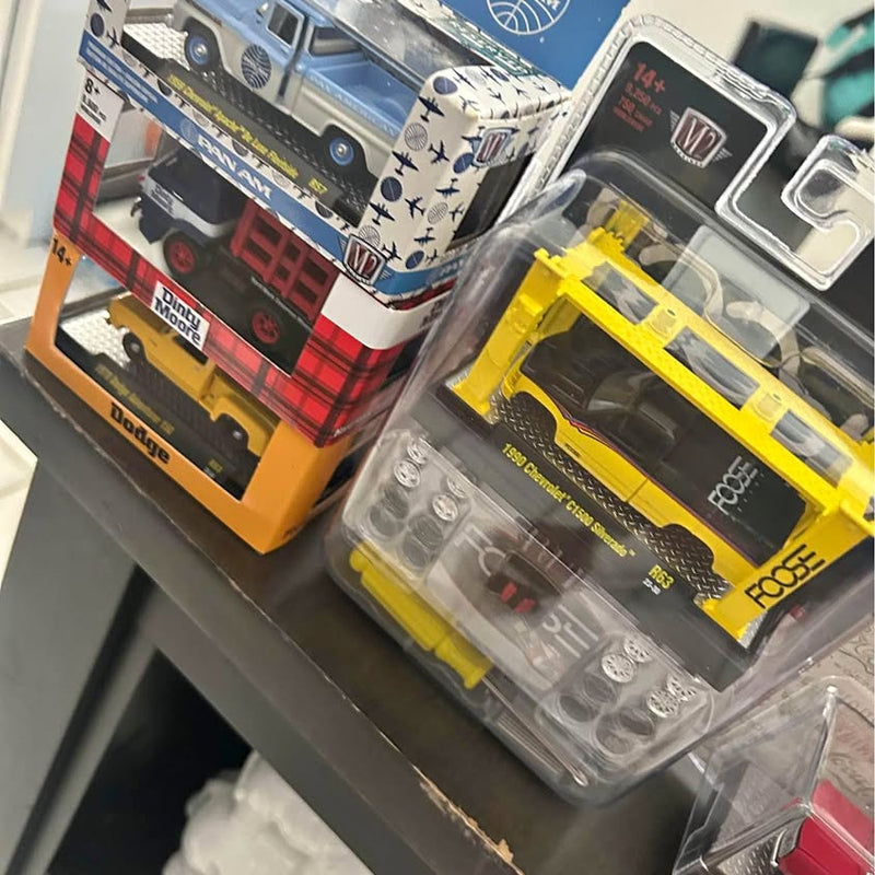 Diecast car model in blister pack, yellow and dark gray, M2 styling