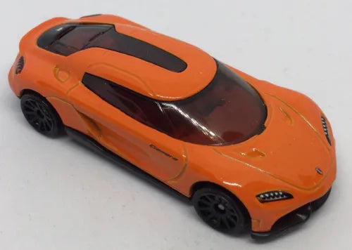 Hot Wheels orange Koenigsegg Gemera diecast car, black hood details