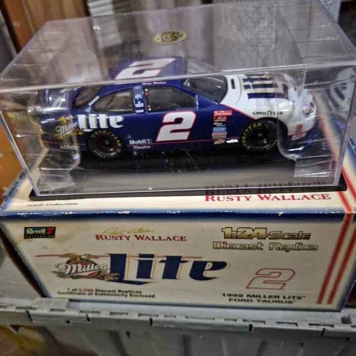1:24 scale Rusty Wallace diecast race car in clear box, blue and white #2