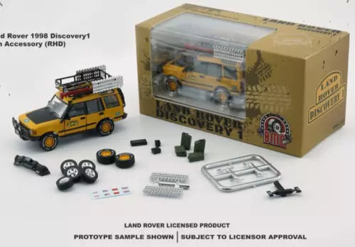 Yellow diecast Land Rover Discovery 1 toy car with accessories in box