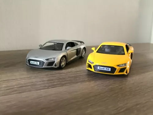 Diecast toy sports car, silver and yellow 2-door coupe with front headlights